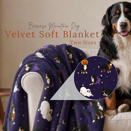 A Bernese Mountain Dog sitting on a cream armchair beside a Halloween Costume Parade throw blanket, with a circular close-up inset showing Bernese Mountain Dogs dressed in Halloween costumes under a starry purple night sky. Text reads "Bernese Mountain Dog Velvet Soft Blanket, Two Sizes."