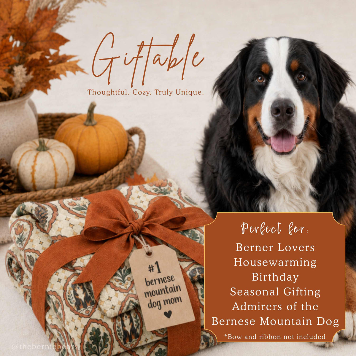 A Bernese Mountain Dog beside a folded Retro Folk Medallion blanket wrapped with a rust-colored ribbon bow and a gift tag reading "#1 Bernese Mountain Dog Mom," among pumpkins and fall foliage. Text reads "Giftable, Thoughtful. Cozy. Truly Unique." and lists it as perfect for Berner lovers, housewarming, birthday, seasonal gifting, and admirers of the Bernese Mountain Dog, with a note that the bow and ribbon are not included.