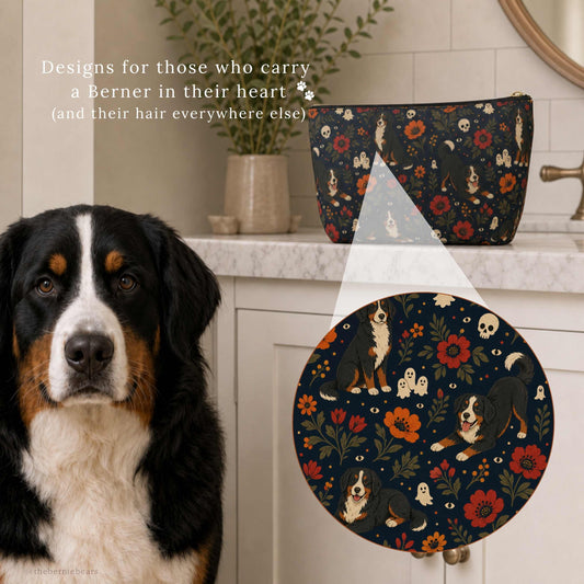 Close-up detail of the Bernese Mountain Dog Moody Boho Floral print on an accessory pouch beside a real Bernese Mountain Dog